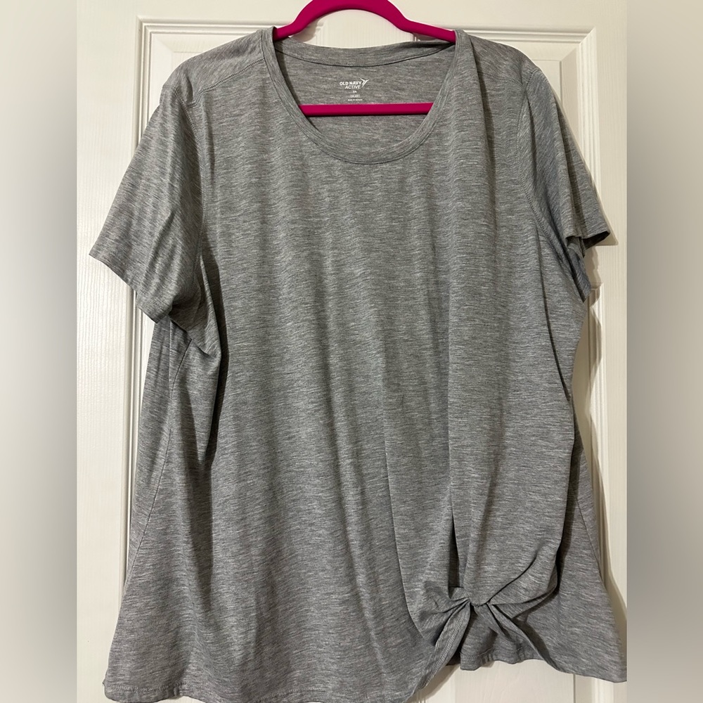 Grey tee with knot on bottom left
